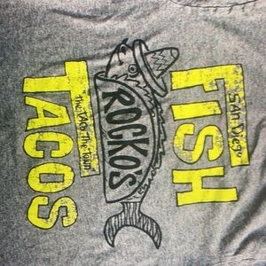 There are shark patterns and text San Diego top